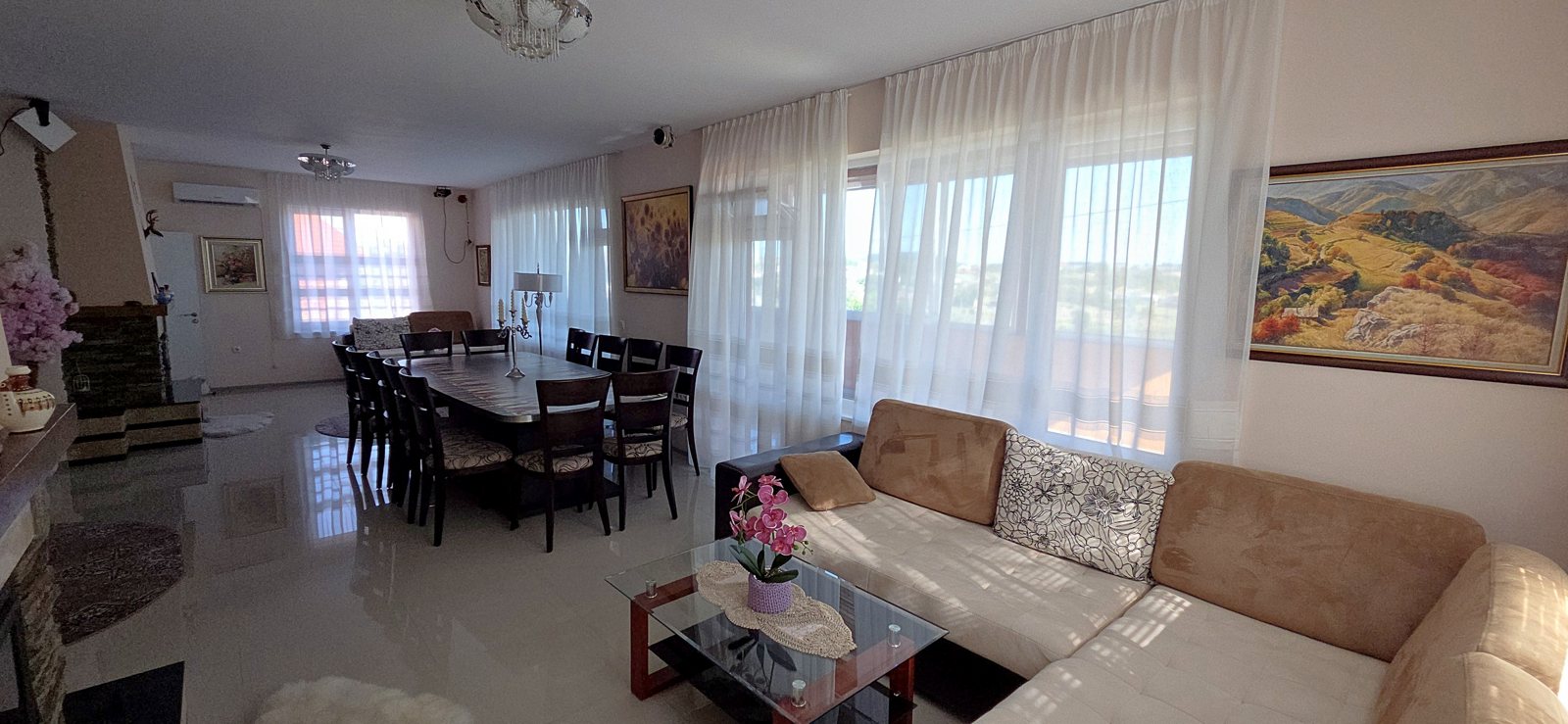 Main living room with dining table and fireplace